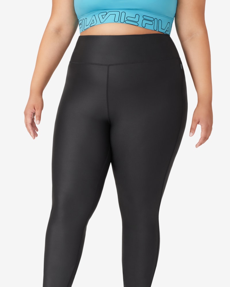 Front of a model wearing a size 1X Girls Night Out Tight in Black by FILA. | dia_product_style_image_id:252670